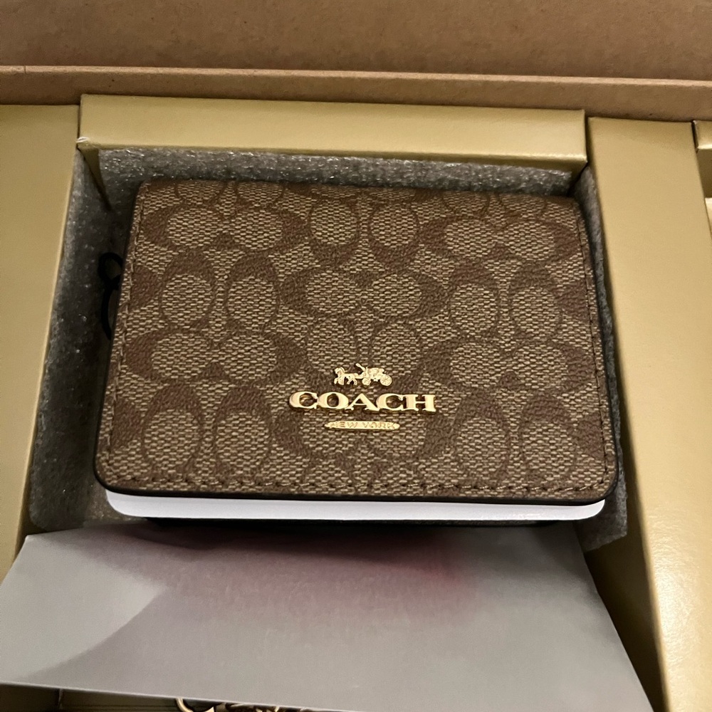 NWT Coach mini wallet with chain and charms new in box